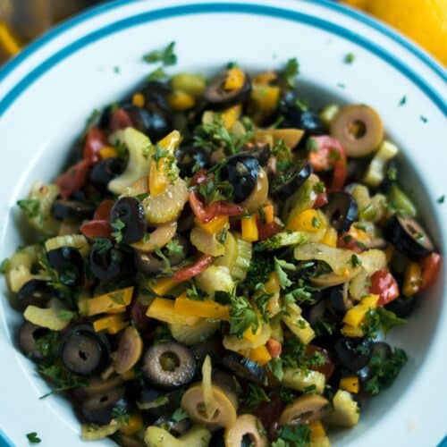 Celery And Olive Salad on a white plate.