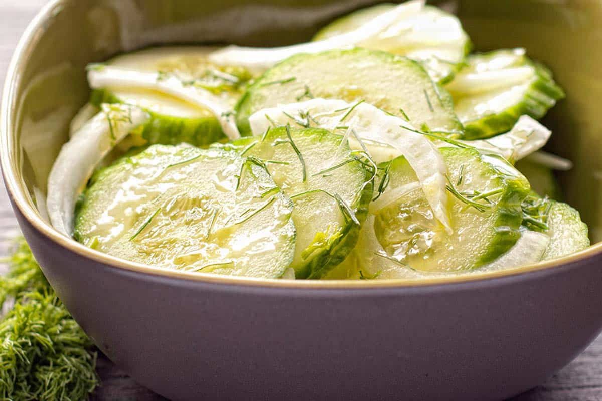 white bowl containing a serving of Cucumber and fennel salad
